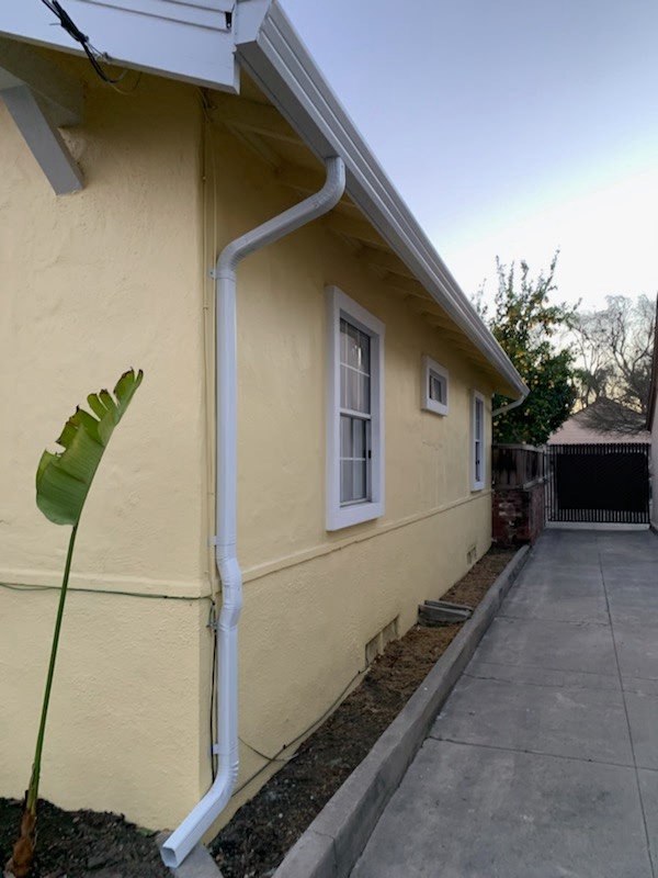Long seamless gutter run along the side of a home
